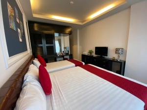 Voodi või voodid majutusasutuse Eclipse Legend Hotel toas