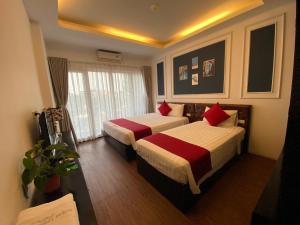 Voodi või voodid majutusasutuse Eclipse Legend Hotel toas