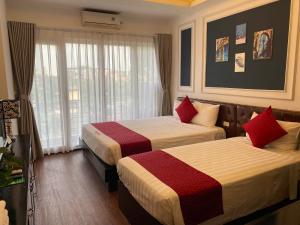 Voodi või voodid majutusasutuse Eclipse Legend Hotel toas