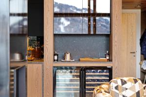 a kitchen with a counter with a stove top oven at K Lodge View in Valdaora