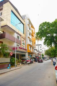 a city street with a building on the side of the road at Octave Hotel AM Garden in Bangalore