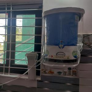 a water heater in a room next to a window at Jamuna homestays in Secunderabad +51 photos
