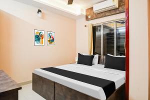 Postel nebo postele na pokoji v ubytování Super Hotel O MOHAR KUNJHA