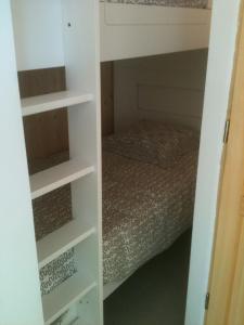 a bedroom with a bed and a book shelf at Gîte d'étape d'Aurouses in Die