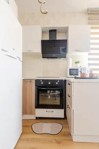 Kuchyň nebo kuchyňský kout v ubytování Deluxe King Suite MAI35