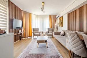 TV a/nebo společenská místnost v ubytování Deluxe King Suite MAI35