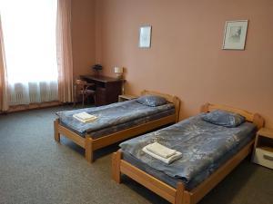 Postel nebo postele na pokoji v ubytování Gamma Hotel