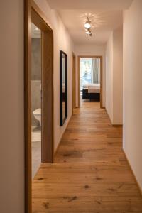 a hallway of a house with wooden floors at New Penthouse near Sölden - Runhof Top11 in Längenfeld