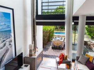 a living room with a view of the ocean at Pool Beach & Golf Troia Reserve V3 in Troia