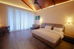 Postel nebo postele na pokoji v ubytování Tiki Farms + 138 fotografií