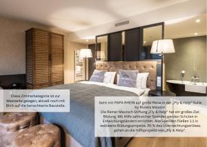 Postel nebo postele na pokoji v ubytování PAPA RHEIN - Hotel & Spa