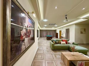 a living room with a couch and a table at Madliena Hills Mansion in Is-Swieqi
