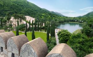 a view of a park with a lake and trees at Raajsa Kumbhalgarh - IHCL SeleQtions in Kumbhalgarh