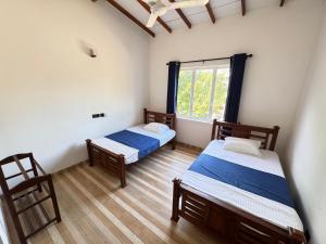 Postel nebo postele na pokoji v ubytování Aruna homestay