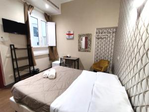 Postel nebo postele na pokoji v ubytování Milazzo23 Guesthouse + 35 fotografií