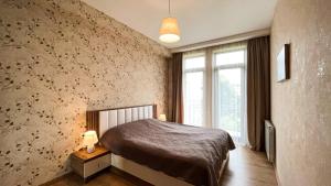 Llit o llits en una habitació de Dani Lux Apartments