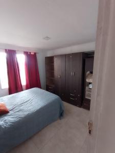 En eller flere senge i et værelse på Aires del Parque 1