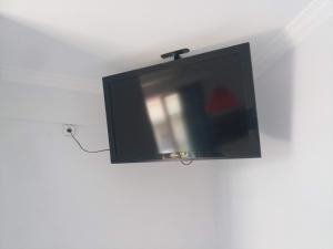 a flat screen tv hanging from a ceiling at NAFPAKTOS APARTMENT AND ROOMS iN PORT in Nafpaktos +21 photos