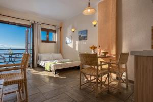 A bed or beds in a room at Agnanti Hotel Apartments