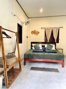 a bedroom with a bed in a room at Khao Sok Green Mountain View in Khao Sok National Park