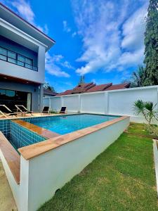 a swimming pool in the backyard of a house at Luna villa Chaweng Samui in Nathon Bay