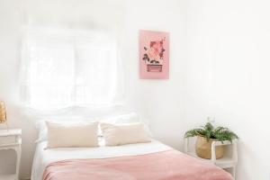 Łóżko lub łóżka w pokoju w obiekcie Villa Ana María