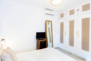 Łóżko lub łóżka w pokoju w obiekcie Villa Ana María