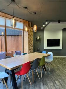 a conference room with a large wooden table and chairs at MiShelter in Migovo