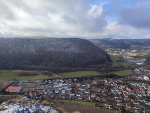 an aerial view of a town in the mountains at Ferienwohnung Unterm Tierstein in Bad Ditzenbach +5 photos