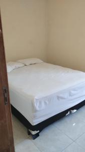 En eller flere senge i et værelse på AGRA familia