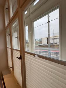 a room with a window with a view of a train at Karolinska Apartment City Center in Ostrava