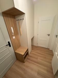 a hallway with a door and a stair case at Karolinska Apartment City Center in Ostrava