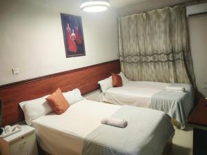 Voodi või voodid majutusasutuse Hongyuan primier hotel toas