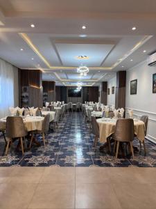 a dining room with tables and chairs in a room at MEDINA ORAN in Oran