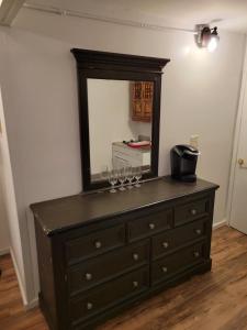 a dresser with a mirror on top of it at The Link Vintage Motel #2 Lovely Studio in Lovelock