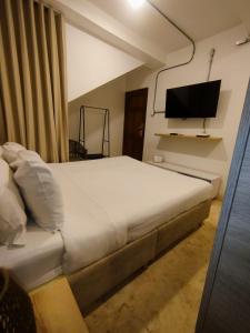 TV a/nebo společenská místnost v ubytování Del Mar Guest House