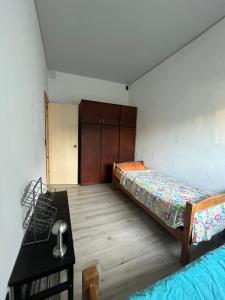 Ένα ή περισσότερα κρεβάτια σε δωμάτιο στο Casa en playa verde, al sur de la ruta