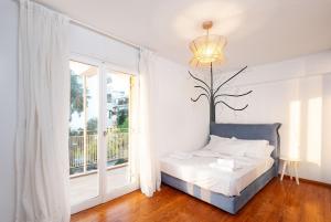 Ένα ή περισσότερα κρεβάτια σε δωμάτιο στο Zeus2 Beach Front Apartment, 3BR