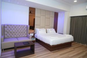 Postel nebo postele na pokoji v ubytování Hotel Grand Sigma