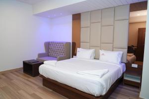 Postel nebo postele na pokoji v ubytování Hotel Grand Sigma