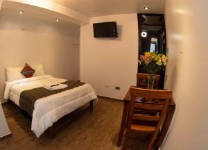 Tranquility Hotel客房内的一张或多张床位