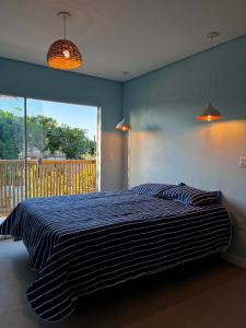 Ένα ή περισσότερα κρεβάτια σε δωμάτιο στο Casa Atelier