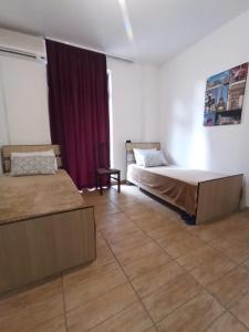 Postel nebo postele na pokoji v ubytování Skanderbeg Square Residences + 2 fotografie
