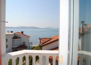 a view of the ocean from a balcony at Cunda Ezer Otel in Cunda