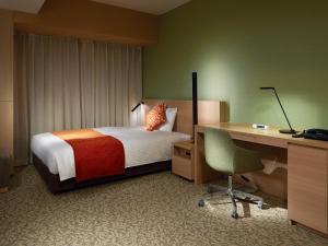 Postel nebo postele na pokoji v ubytování Mitsui Garden Hotel Kashiwa-No-Ha - Chiba