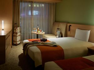 Postel nebo postele na pokoji v ubytování Mitsui Garden Hotel Kashiwa-No-Ha - Chiba