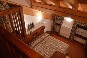 Postel nebo postele na pokoji v ubytování Hotel Petit Giles + 17 fotografií