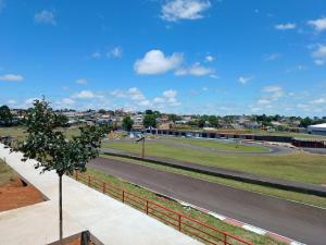 a view of a race track with a tree at Hospedagem Caminho do Parque in Vacaria