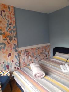 a bedroom with a bed with a pillow on it at Apartman Nomino in Zvornik