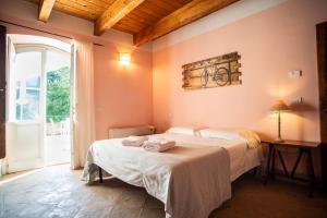 Ένα ή περισσότερα κρεβάτια σε δωμάτιο στο Casale Merlino +65 φωτογραφίες